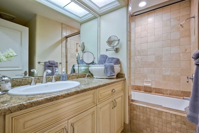 31350 Lake Vista Cir, Bonsall, CA 92003 - bathroom featuring vanity, tiled shower / bath, and a skylight
