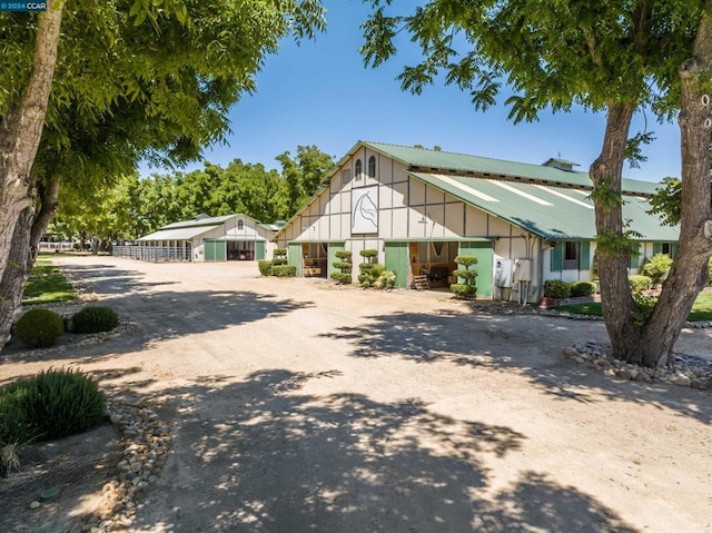 view of front of home with an outdoor structure