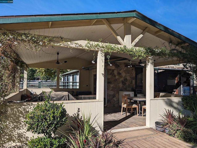 view of patio / terrace with ceiling fan and a wooden deck