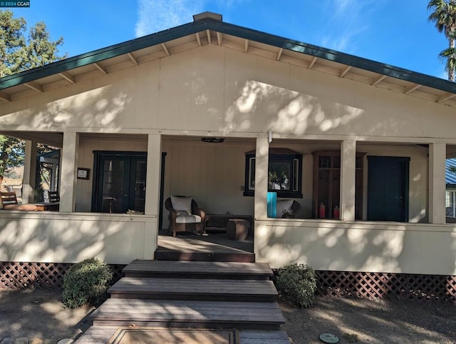 back of property featuring a porch