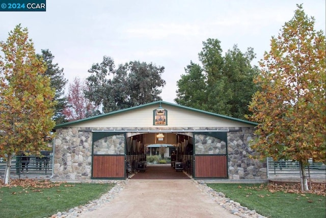 view of front of house with an outbuilding