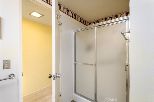 bathroom featuring an enclosed shower