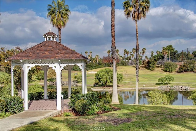 view of community with a water view, a gazebo, and a lawn