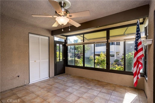 interior space with ceiling fan and plenty of natural light