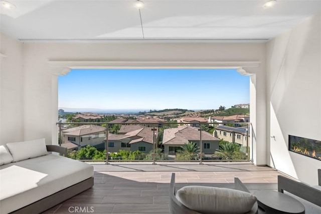 balcony featuring an outdoor hangout area and a residential view