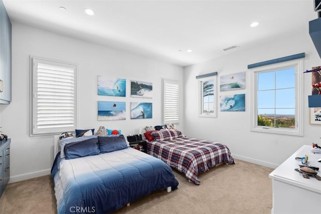 bedroom featuring baseboards, recessed lighting, visible vents, and light colored carpet