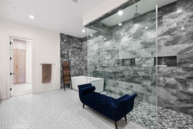 bathroom with a walk in shower, a freestanding bath, baseboards, and recessed lighting