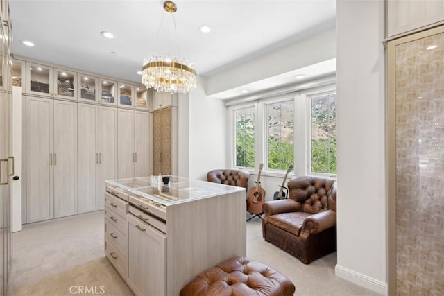 spacious closet with light carpet and a notable chandelier