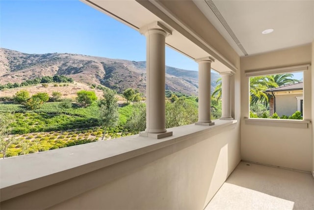 balcony featuring a mountain view