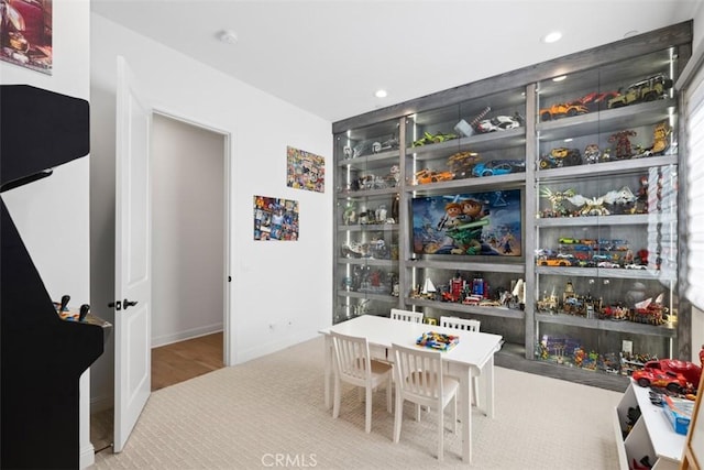 dining room with baseboards and recessed lighting