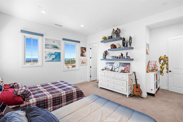 bedroom featuring recessed lighting, light carpet, visible vents, and baseboards