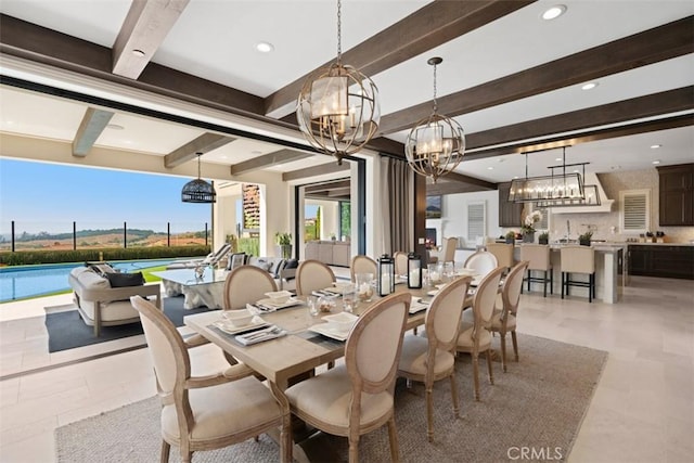 dining space featuring a chandelier, beam ceiling, and recessed lighting