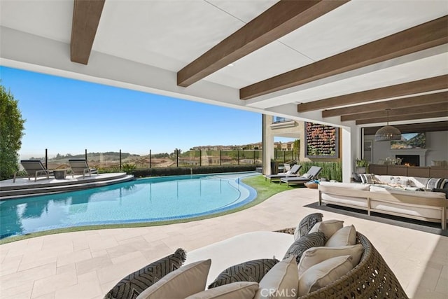 view of pool featuring fence, outdoor lounge area, a fenced in pool, and a patio