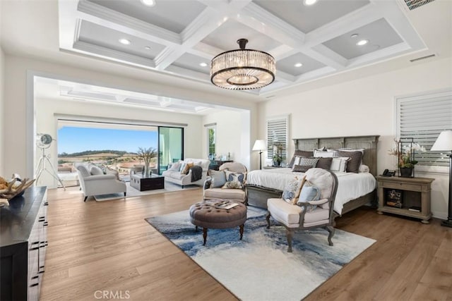 bedroom with coffered ceiling, beam ceiling, visible vents, and wood finished floors