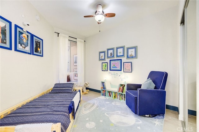 bedroom featuring a closet, ceiling fan, and light wood-type flooring