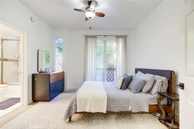 bedroom with connected bathroom, ceiling fan, and wood-type flooring