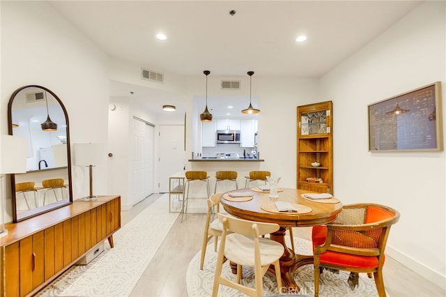 dining area featuring light hardwood / wood-style floors