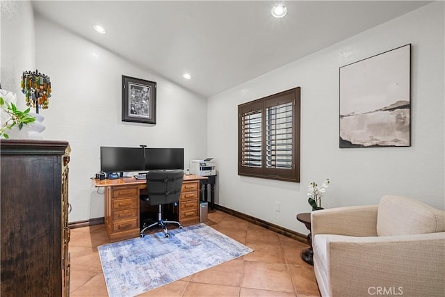 office space featuring light tile patterned floors and lofted ceiling