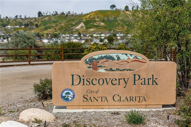 community sign featuring a mountain view