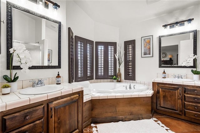 bathroom with vanity, tile patterned floors, and independent shower and bath