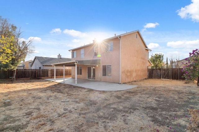 rear view of house featuring a patio area