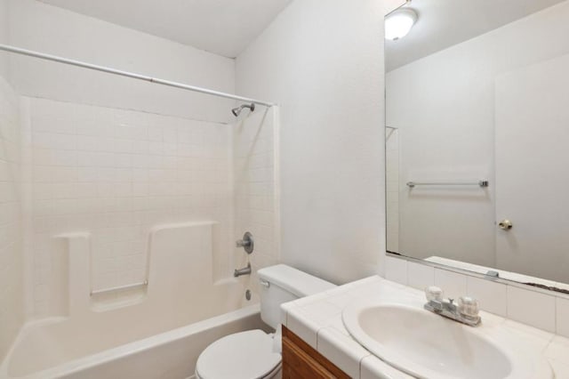 full bathroom featuring vanity, washtub / shower combination, and toilet