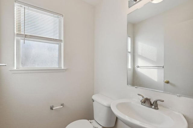 bathroom featuring toilet and sink