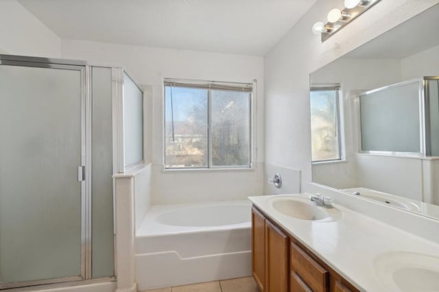 bathroom featuring vanity, plus walk in shower, and tile patterned flooring