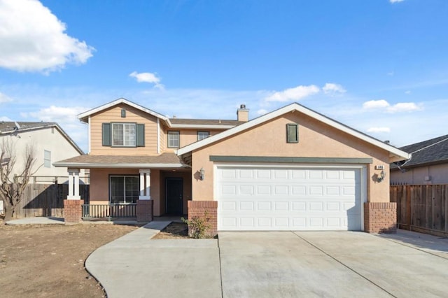 view of front of property with a garage and a porch