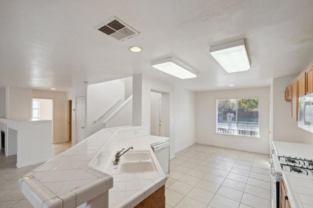 bathroom with sink and tile patterned floors