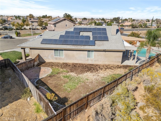 view of side of home with solar panels