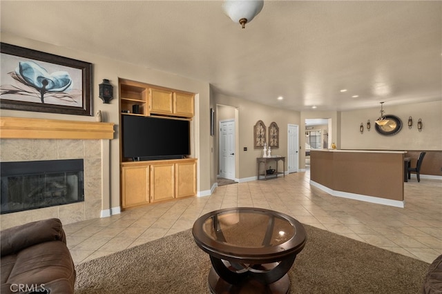 tiled living room featuring a tiled fireplace