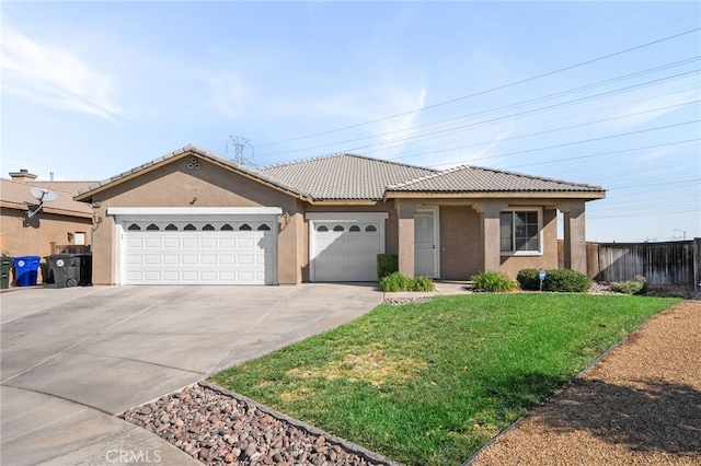 view of front of house with a front yard and a garage