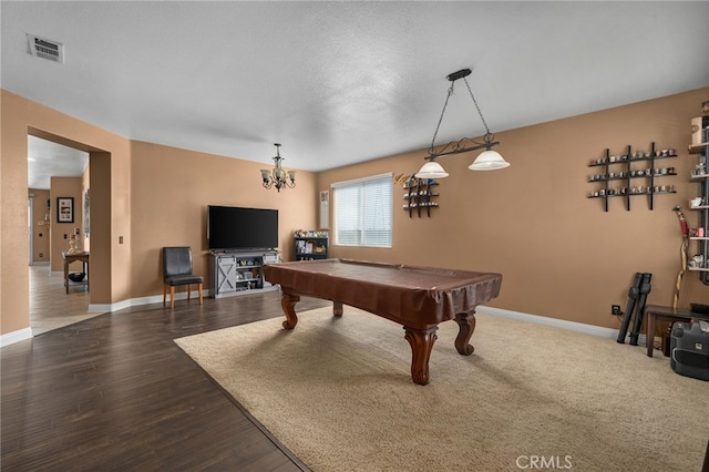 game room featuring an inviting chandelier, billiards, a textured ceiling, and hardwood / wood-style flooring