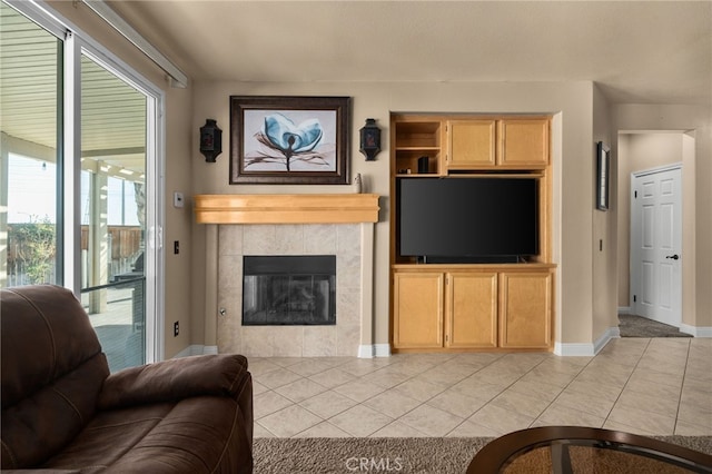 living room featuring light tile patterned floors and a fireplace