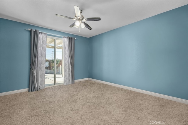 carpeted empty room featuring ceiling fan