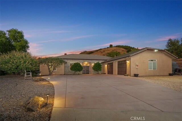 45600 La Cruz Dr, Temecula, CA 92590 - view of front of home featuring an attached garage, concrete driveway, and stucco siding
