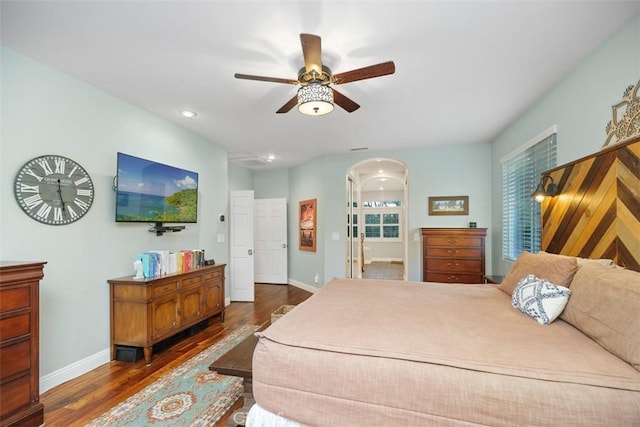 bedroom featuring ceiling fan and dark wood-type flooring