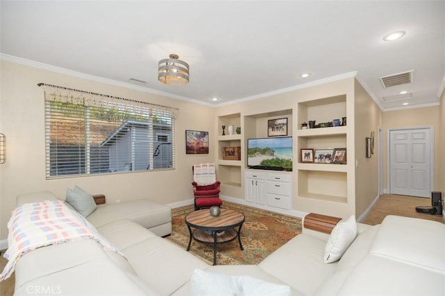 living room with built in features and crown molding