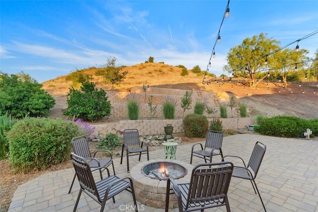 view of patio with an outdoor fire pit