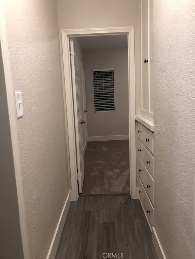 hall with dark hardwood / wood-style floors