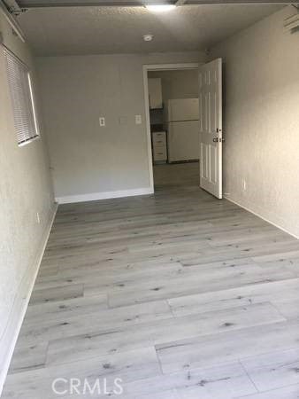 spare room featuring light hardwood / wood-style floors