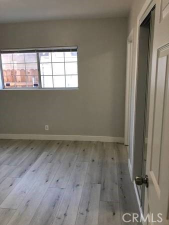 unfurnished room featuring light hardwood / wood-style flooring