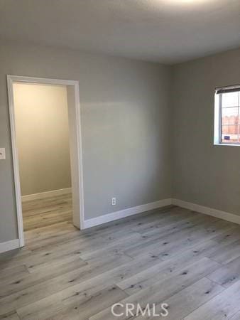 empty room with light wood-type flooring