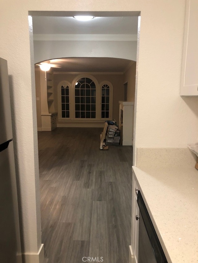 hallway with crown molding and dark hardwood / wood-style floors