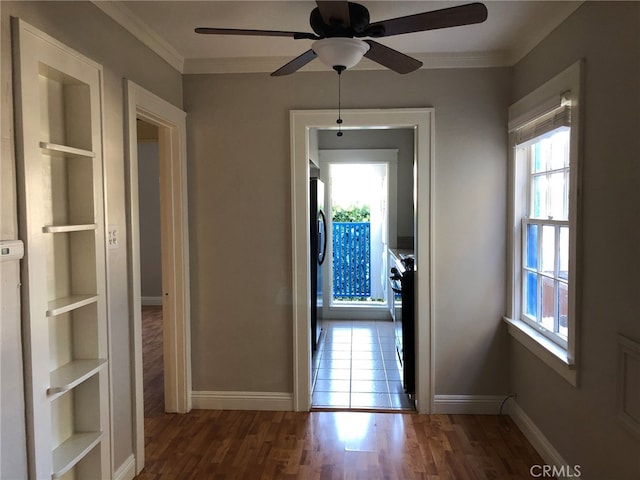 hall featuring crown molding and dark hardwood / wood-style floors