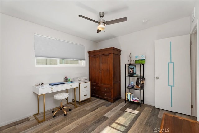 office space featuring dark wood-type flooring and ceiling fan