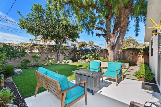 view of patio featuring an outdoor living space with a fire pit