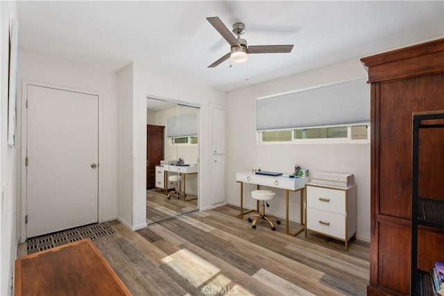 office featuring ceiling fan and light hardwood / wood-style floors