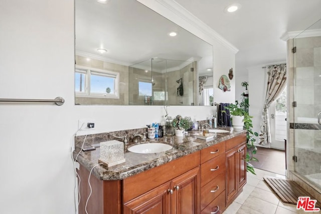 bathroom with vanity, tile patterned floors, walk in shower, and ornamental molding